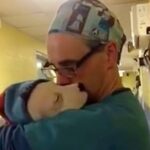 Vet Cradles Scared and Crying Rescue Puppy Just Like a Baby After Surgery