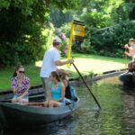 Giethoorn, a village in the Netherlands, is renowned for its absence of roads, resembling a scene from a fairytale. Residents and visitors navigate the village via canals and footpaths.