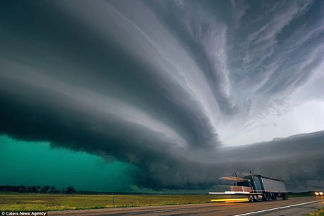 A mesmerizing sight: a millennium storm traversing a stunning desert veiled in clouds