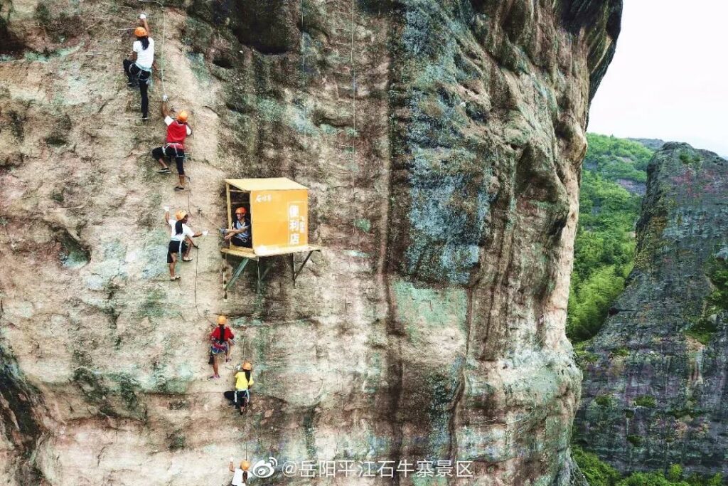 This petite shop hangs precariously from a towering cliff