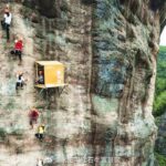 This petite shop hangs precariously from a towering cliff